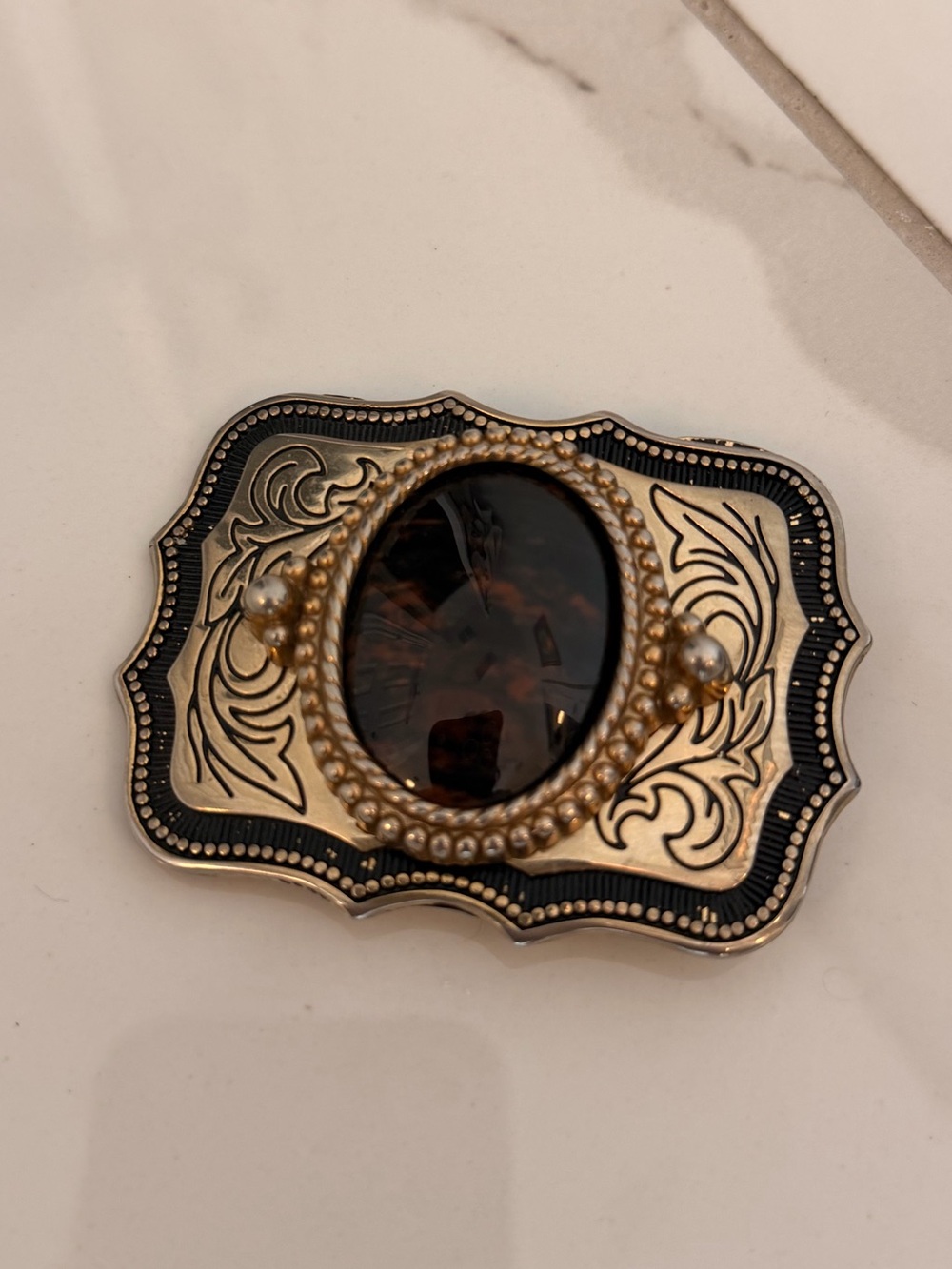 Vintage-Style Gold and Black Ornate Belt Buckle with Dark Amber